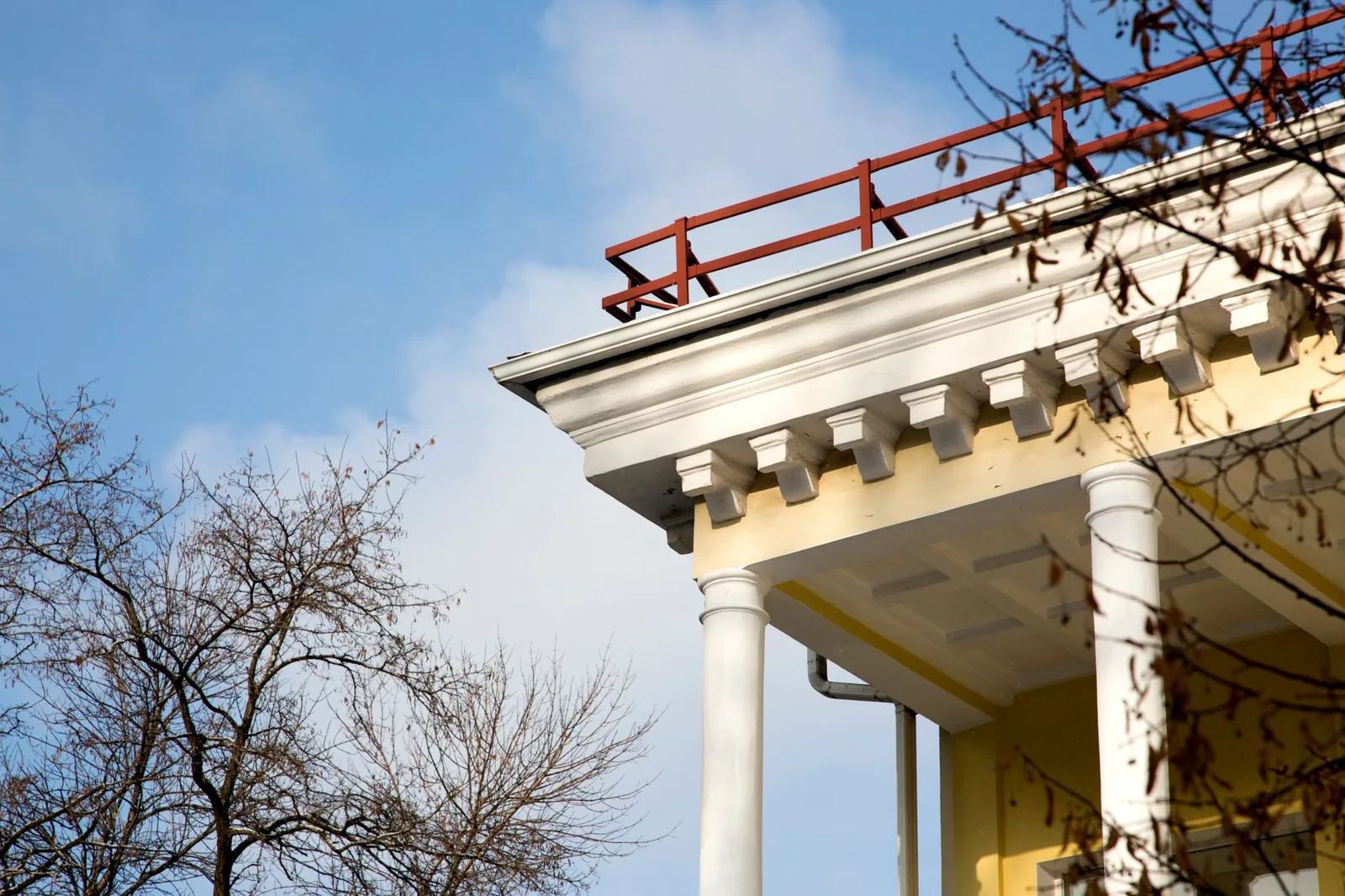 half round vs k style gutters shown on a historic brick home's roofline