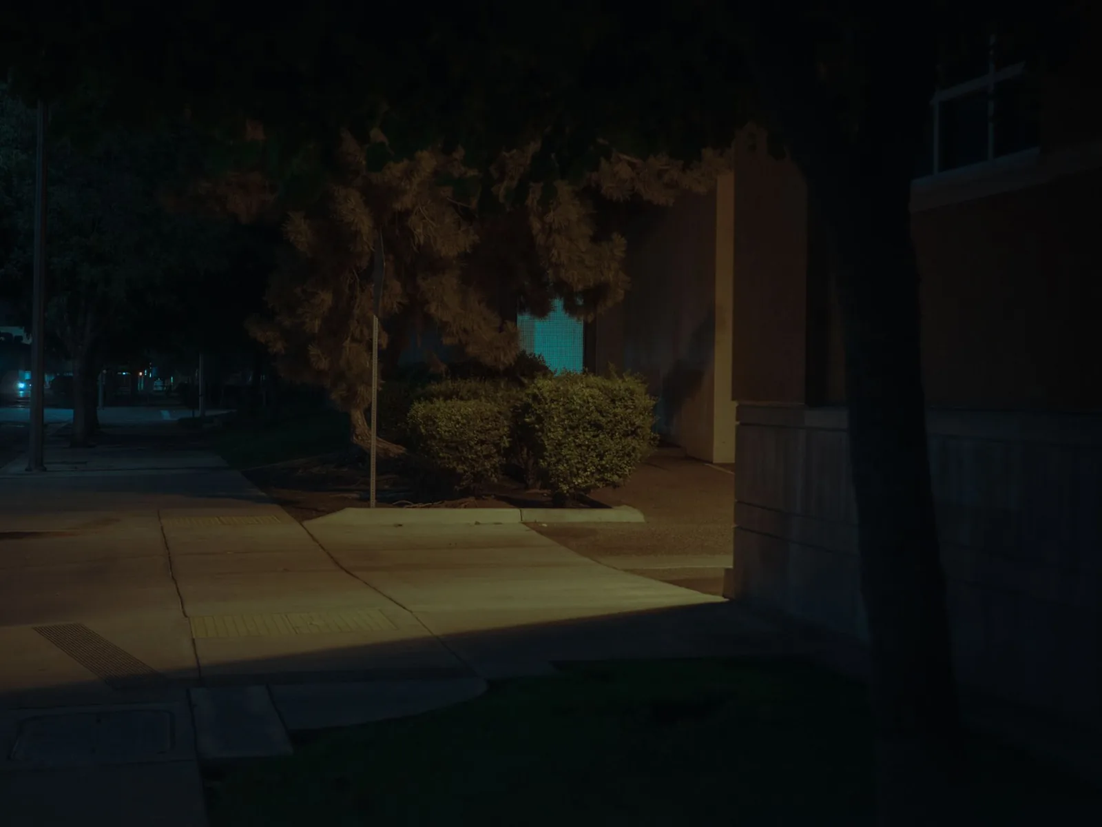 Path lighting ideas with solar bollards lining a gravel garden walkway