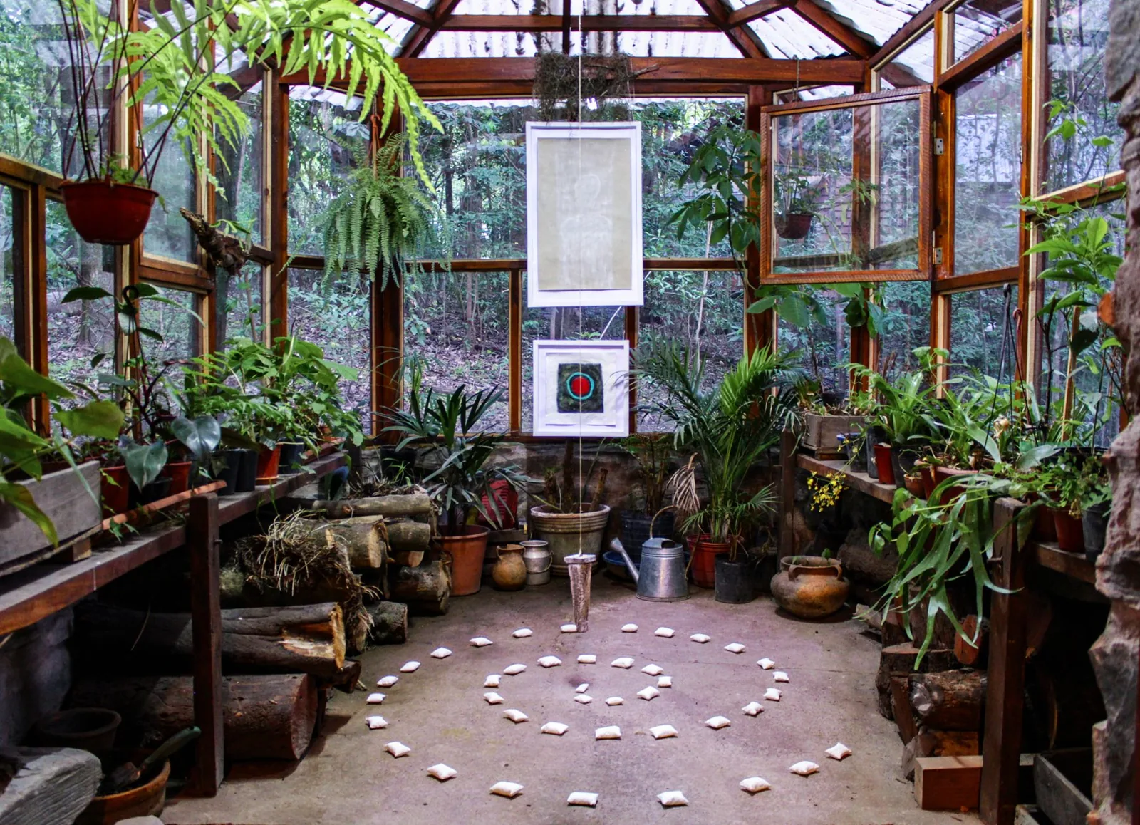 Thrifty secondhand furnishings in a bright budget sunroom
