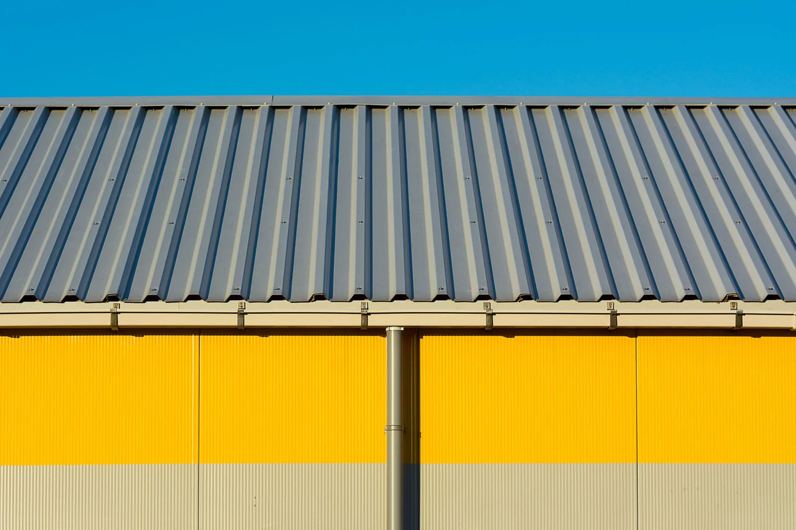Aluminum seamless gutters installed along a roofline