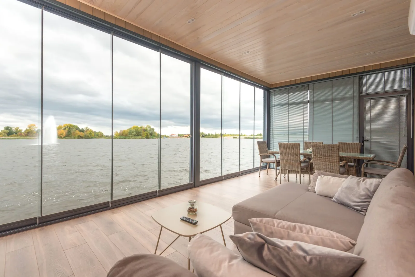 A four-season patio enclosure with insulated glass walls adds usable square footage